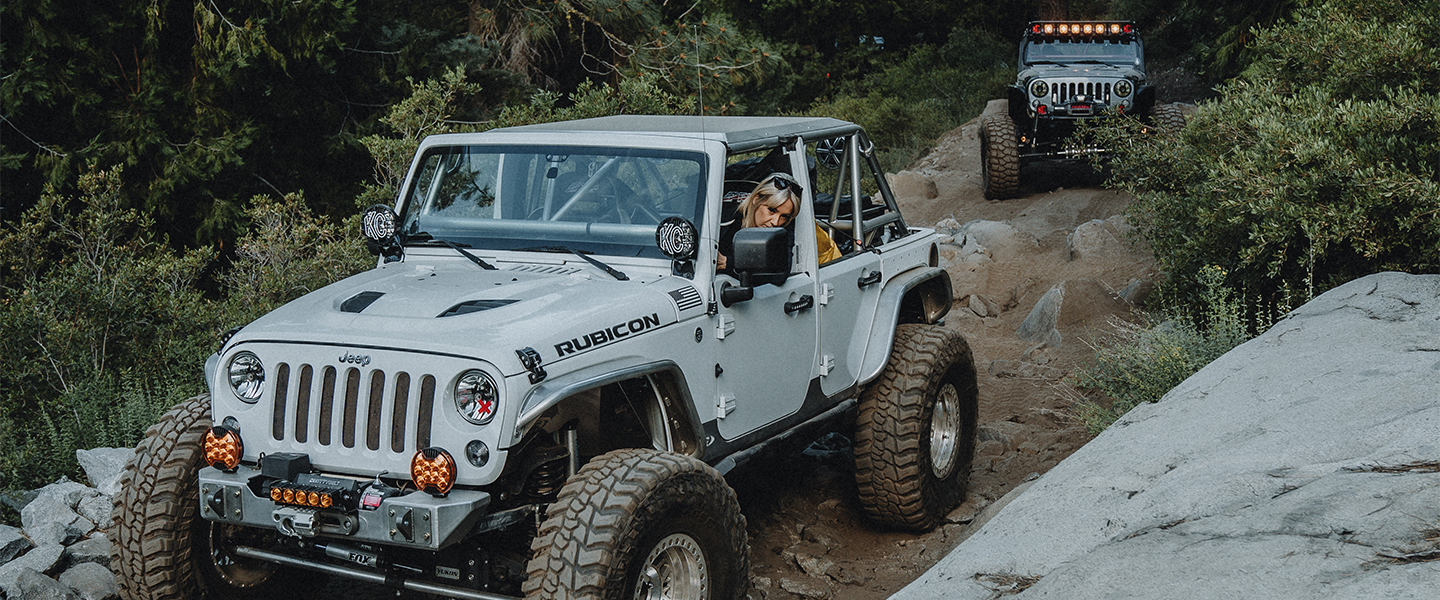 Kayla in her Rubicon getting ready to crawl over some rocks on the Rubicon Trail.